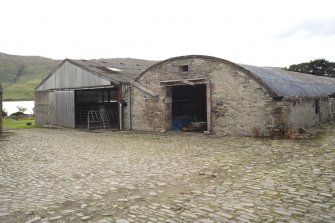 Pitched and arched roof byres to S of steading, view from E