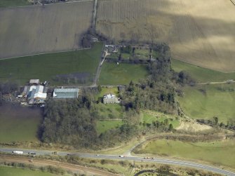 Oblique aerial view centred on the house and the walled garden, taken from the SW.