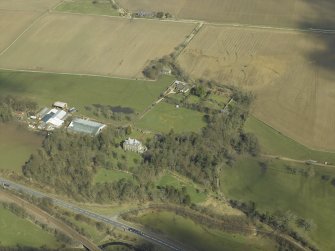 Oblique aerial view centred on the house and the walled garden, taken from the SSW.