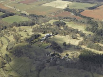 General oblique aerial view centred on the country house and walled garden, with the tower and stable adjacent, taken from the ESE.