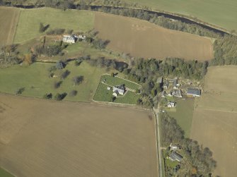 General oblique aerial view centred on the churches and burial-ground with the country house, school, farmhouse and farmsteading adjacent, taken from the SSE.