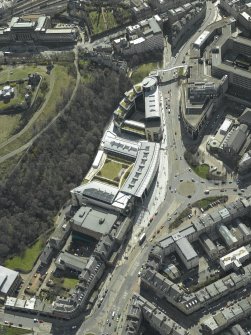 Oblique aerial view centred on the hotel, cinemas and theatre, taken from the NNE.