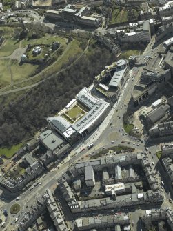 Oblique aerial view centred on the hotel, cinemas and theatre, taken from the NNW.