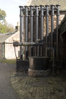 View of annular condenser and tar pit. The condenser removes tar (along with the scrubber and the hydraulic main) from the gas as it is sucked from the hydraulic main by the exhauster.