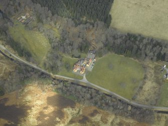 Oblique aerial view centred on the lodge, taken from the SSW.