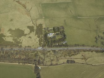Oblique aerial view centred on the country house and landscaped garden, taken from the S.
