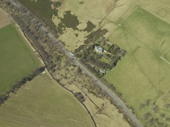 Oblique aerial view centred on the country house and landscaped garden, taken from the SE.