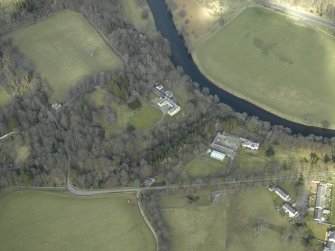 Oblique aerial view centred on the country house with the farmsteading, farmhouse and lodge adjacent, taken from the SSE.