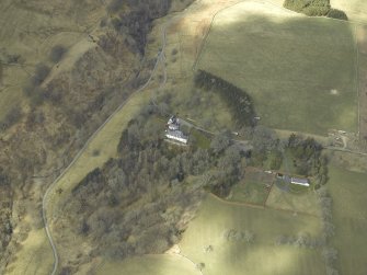 Oblique aerial view centred on country house, taken from the SE.