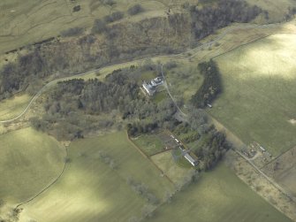 Oblique aerial view centred on country house, taken from the E.