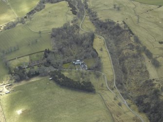 Oblique aerial view centred on country house, taken from the N.