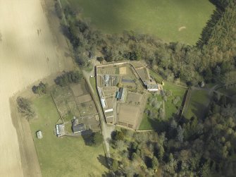 Oblique aerial view centred on the house, taken from the WSW.