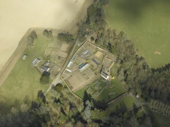 Oblique aerial view centred on the house, taken from the SW.