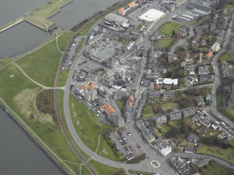 Oblique aerial view centred on the cinema, club and theatre with the church adjacent, taken from the SW.