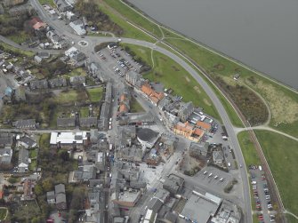 Oblique aerial view centred on the cinema, club and theatre with the church adjacent, taken from the E.