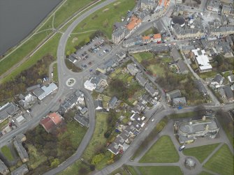Oblique aerial view centred on the church, clock tower, library and townhall with the cinema, club and theatre adjacent, taken from the SSE.