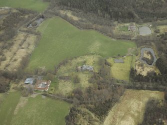 Oblique aerial view centred on the country house, walled garden, farmsteading, stables and dovecot, with the farmstead and corn mill adjacent, taken from the W.