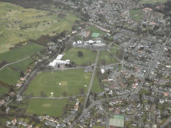 General oblique aerial view centred on the school and swimming pool, taken from the WSW.