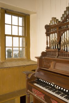 Interior. Detail of window and organ