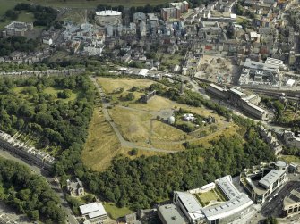 Oblique aerial view centred on the observatories, monuments, cinema, hotel and offices, taken from the NW.