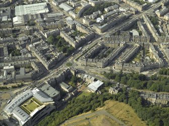 Oblique aerial view centred on the hotel, cinemas and theatre, taken from the SSE.