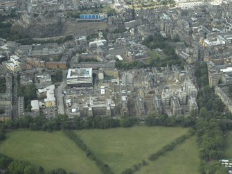 General oblique aerial view centred on the redevelopment of the hospital for housing with the school adjacent and the castle in the distance, taken from the SSW.