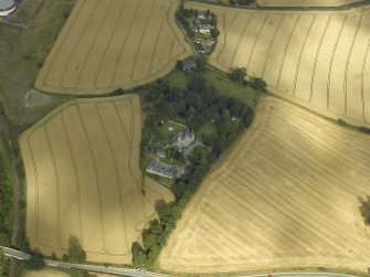 Oblique aerial view centred on the Laird's house, dovecot and walled garden, taken from the WSW.