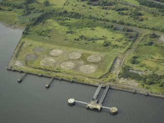 Oblique aerial view of the remains of the shipyard centred on the piers, taken from the S.