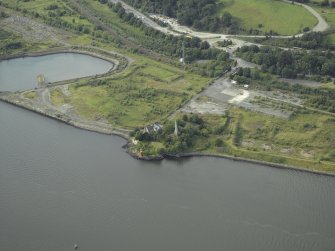 Oblique aerial view of the remains of the shipyard centred on the castle, taken from the SE.