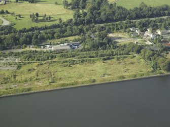 Oblique aerial view of the remains of the shipyard, taken from the SSW.