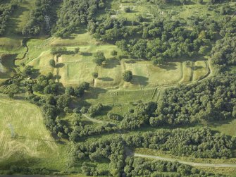 Oblique aerial view centred on the remains of Rough Castle Roman fort and the course of the Antonine Wall, taken from the S.