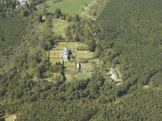 Oblique aerial view of the country house with the cottage and laundry adjacent, taken from the E.