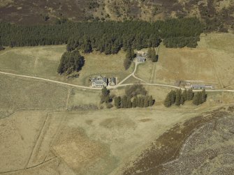 Oblique aerial view centred on the lodge with the keepers house and kennels adjacent, taken from the SE.