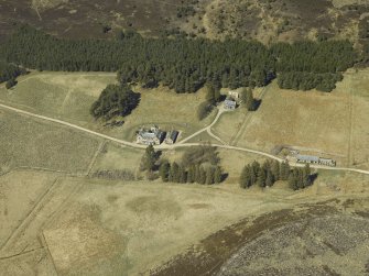 Oblique aerial view centred on the lodge with the keepers house and kennels adjacent, taken from the SE.