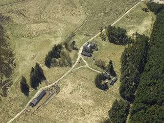 Oblique aerial view centred on the lodge with the keepers house and kennels adjacent, taken from the NE.