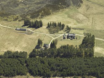 Oblique aerial view centred on the lodge with the keepers house and kennels adjacent, taken from the NNW.