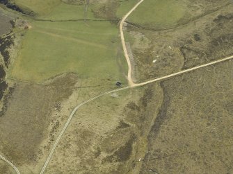 Oblique aerial view centred on the remains of the limekiln, taken from the N.