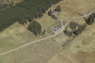 Oblique aerial view centred on the lodge with the keepers house and the kennels adjacent, taken from the SW.