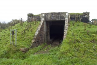 View.  Entrance to magazine showing brick abutments and metal  identification board from SW.