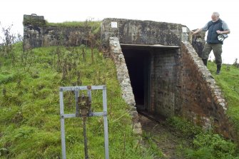 View.  Entrance to magazine showing brick abutments andmetal  identification board from W.