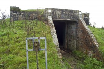 View.  Entrance to magazine showing brick abutments andmetal  identification board from W.