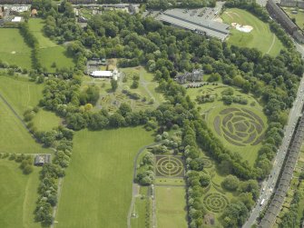 Oblique aerial view of the garden, museum and conservatory, taken from the .