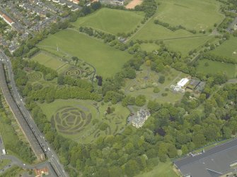 Oblique aerial view of the garden, museum and conservatory, taken from the SE.