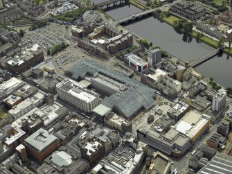 General oblique aerial view centred on the shopping centre with the bridges adjacent, taken from the N.
