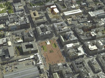 Oblique aerial view centred on the city chambers and square, taken from the WNW.