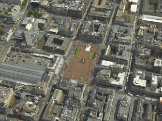 Oblique aerial view centred on the city chambers and square, taken from the W.