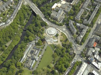 Oblique aerial view centred on the botanic gardens, glasshouses and conservatory, taken from the WSW.