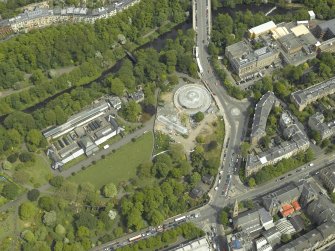 Oblique aerial view centred on the botanic gardens, glasshouses and conservatory, taken from the SW.