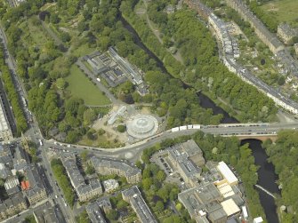 Oblique aerial view centred on the botanic gardens, glasshouses and conservatory, taken from the SSE.