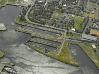 Oblique aerial view centred on the docks, taken from the N.